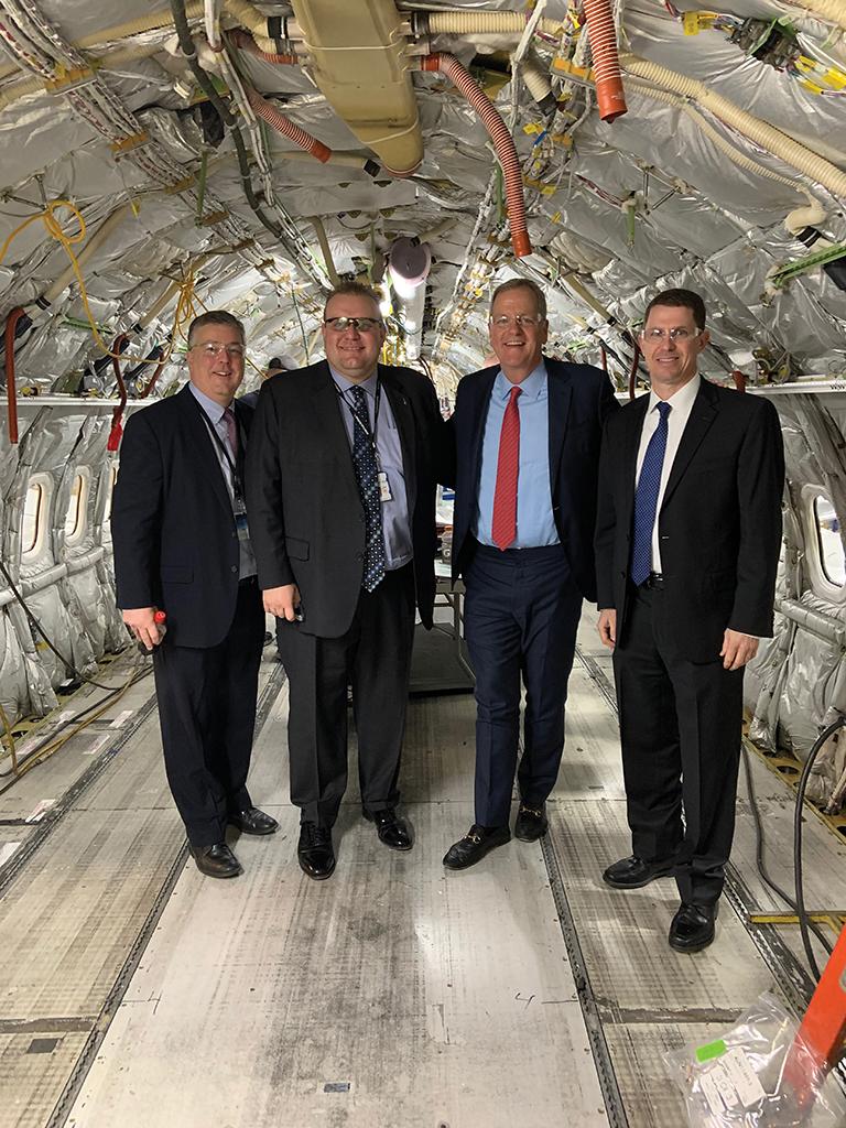 Inside the prototype 737 modification called OASIS prior to the installation of a completely new interior. From left: Craig Barton. vice president of technical operations; Erik Olund, managing director base maintenance; CEO Doug Parker and Kevin Brickner, senior vice president of technical operations. Credit: Lee Ann Shay/AW&ST