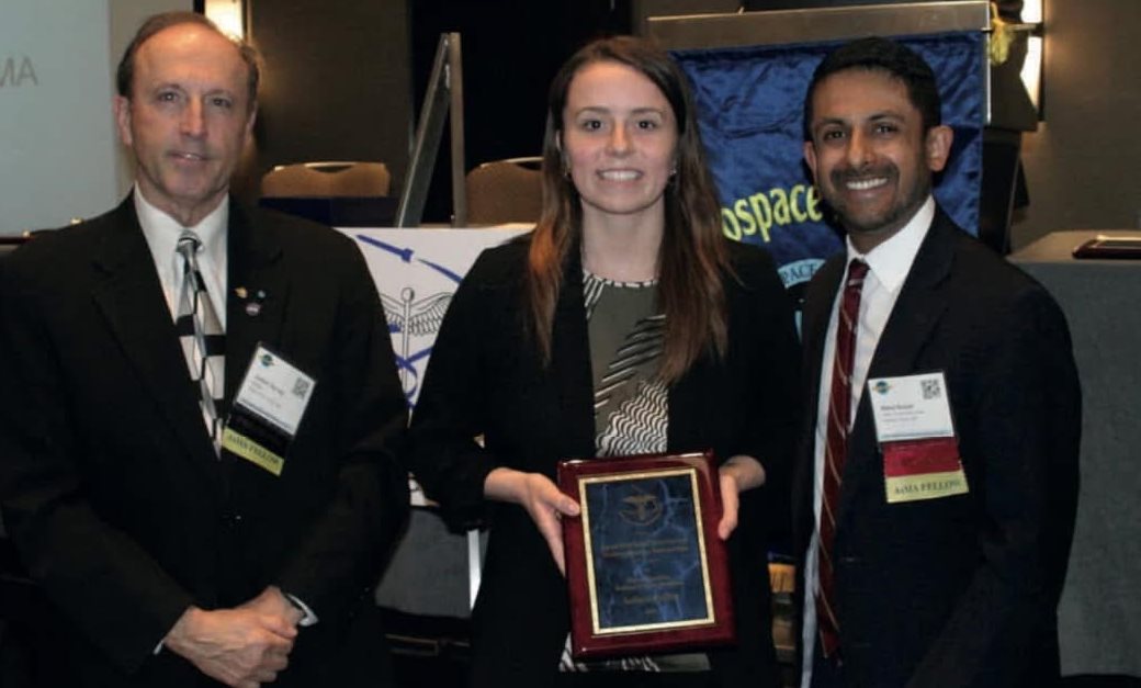 Gaffey accepting the Space Medicine Association Undergraduate Scholarship from the Aerospace Medicine Association, with Joe Dervay and Rahul Suresh-former and current AsMA presidents.