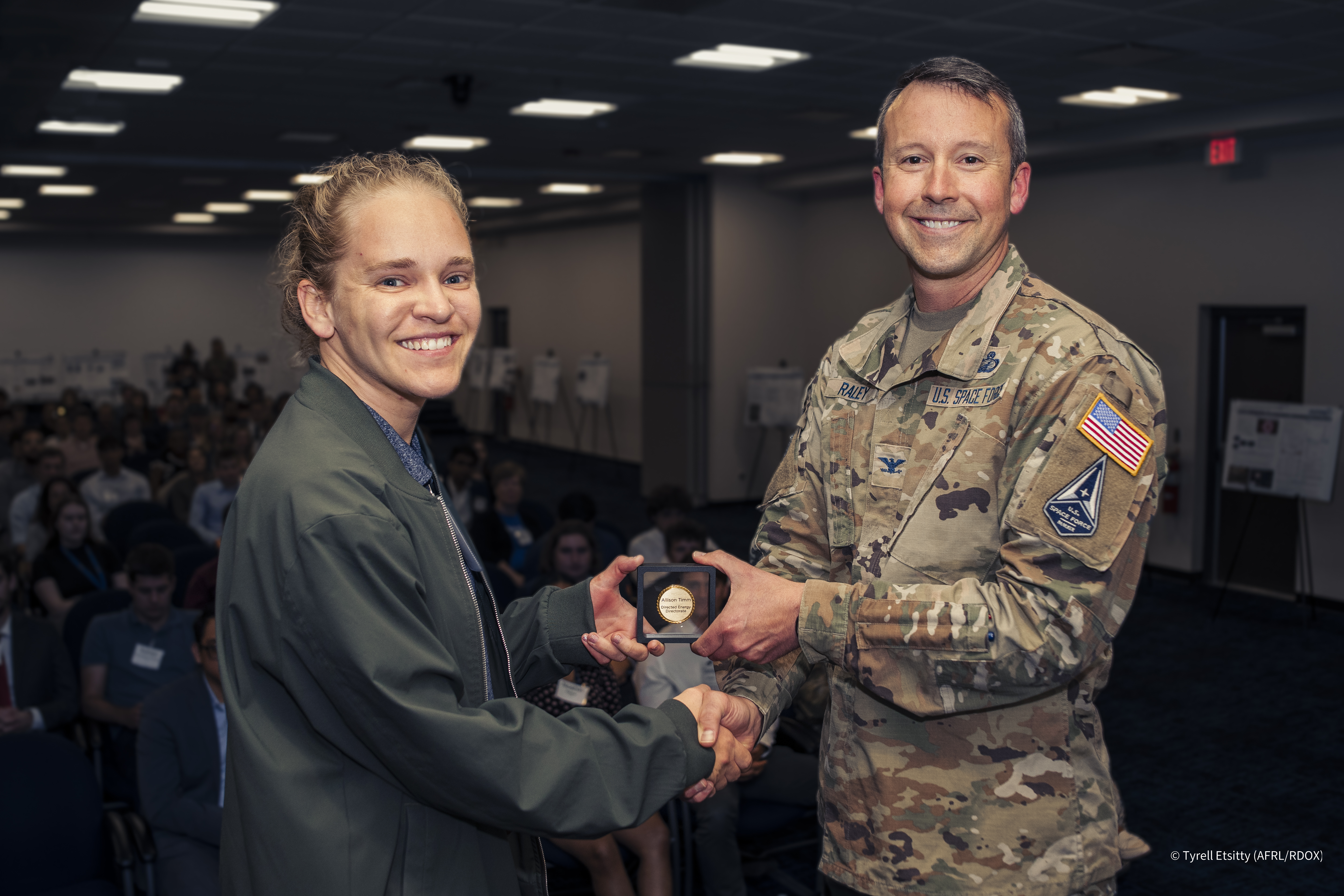 At the conclusion of her second summer,&nbsp;Timm was awarded the 2024 Outstanding Scholar Award for the Directed Energy Directorate. She was presented this award by Colonel Jeremy A. Raley.