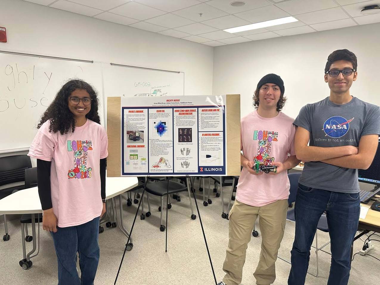Bhardwaj and her teammates Adam Casselman and Siddhant Panse presenting their maze navigating robot, Mighty Mouse, at Engineering Open House 2025.