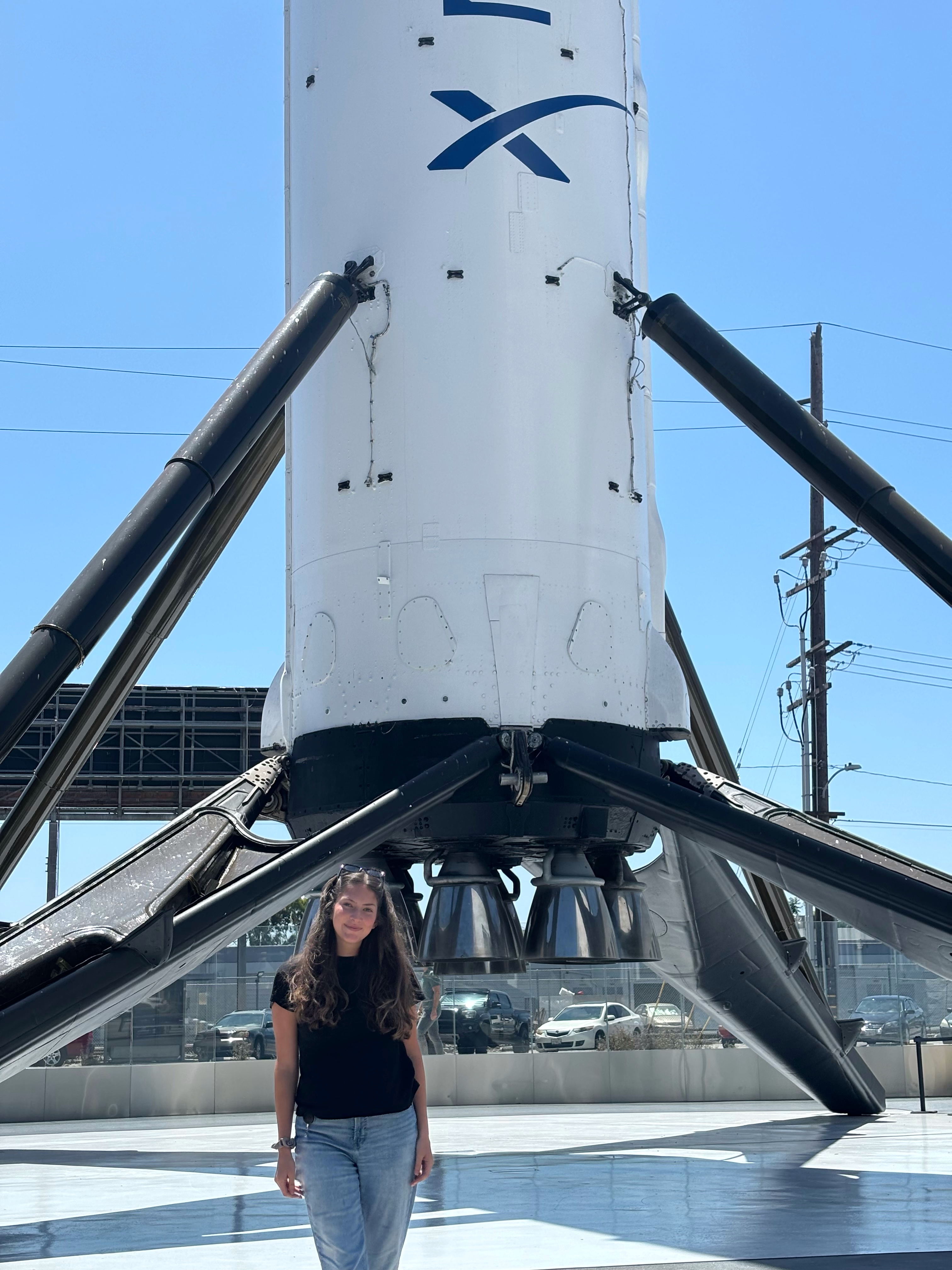 Frankethor during her 2024 SpaceX internship, pictured in front of the first Falcon 9 booster.