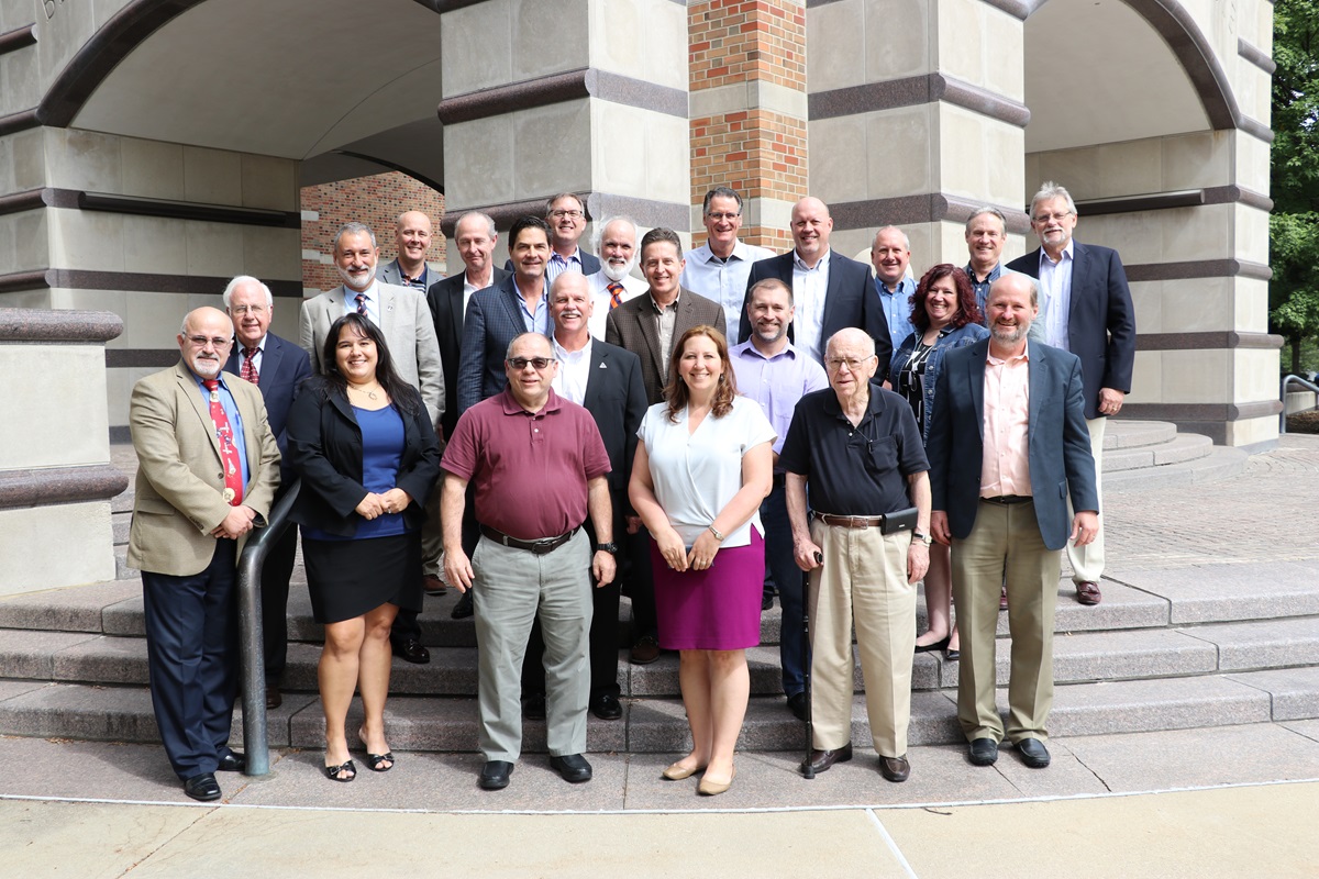 Group photo of the 2018 Alumni Board. Dave Riley top row, second from right. Harry Hiltonm, front row, second from right.