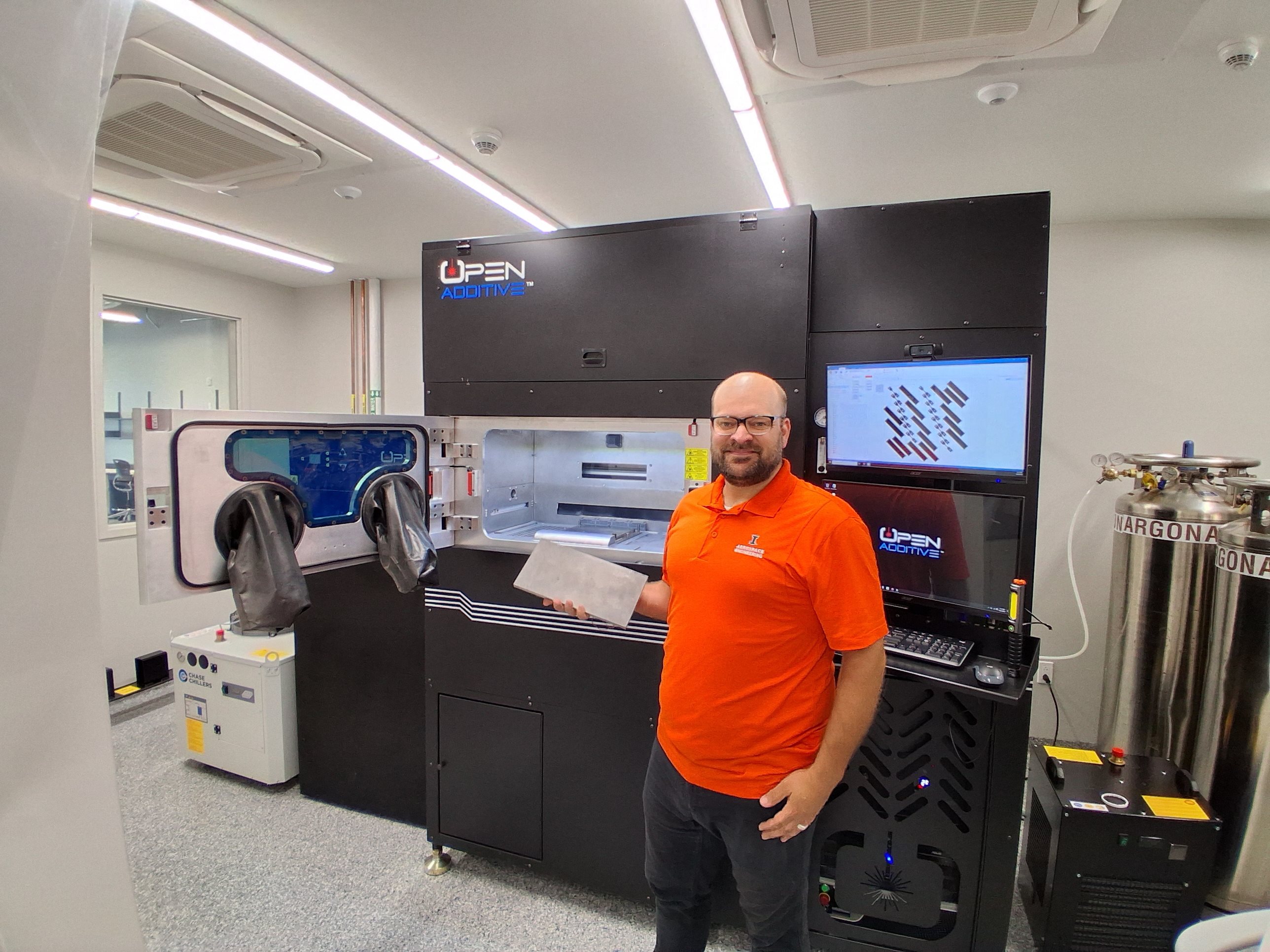 David Ehrhardt with a new 3D printer that prints in metal.