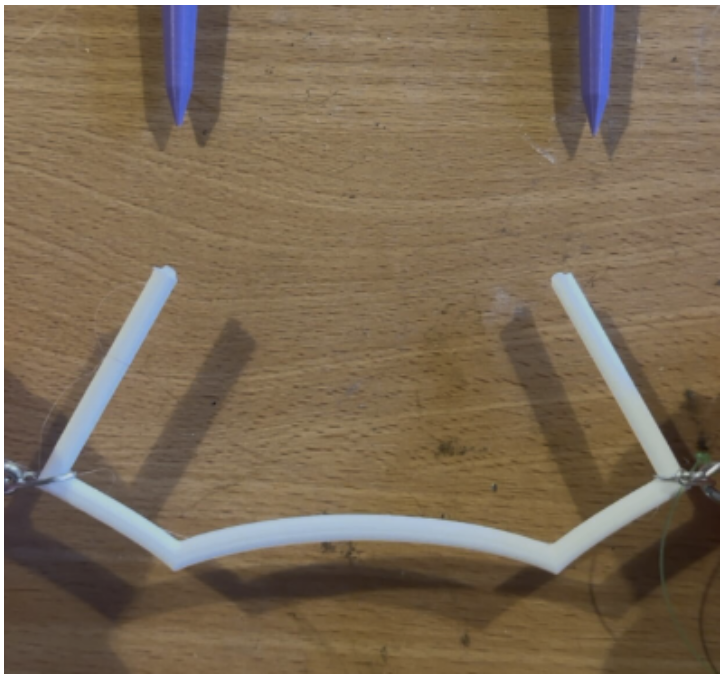 The clips were made of specific brand of PLA filament that was elastic enough to bend and return to its previous shape.