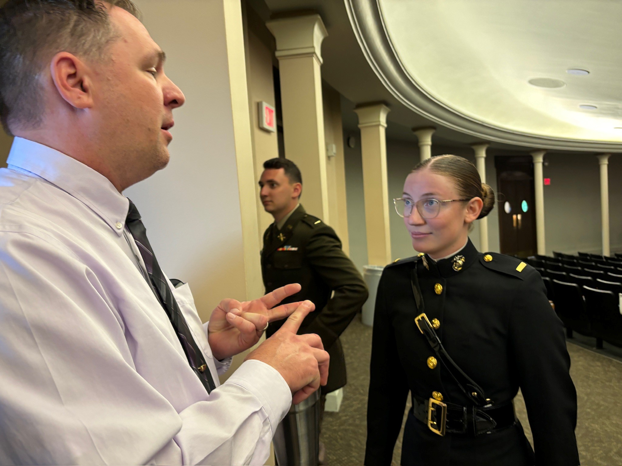 Jason Merret talks with Madi Whitlock at her ROTC Commissioning Ceremony in May