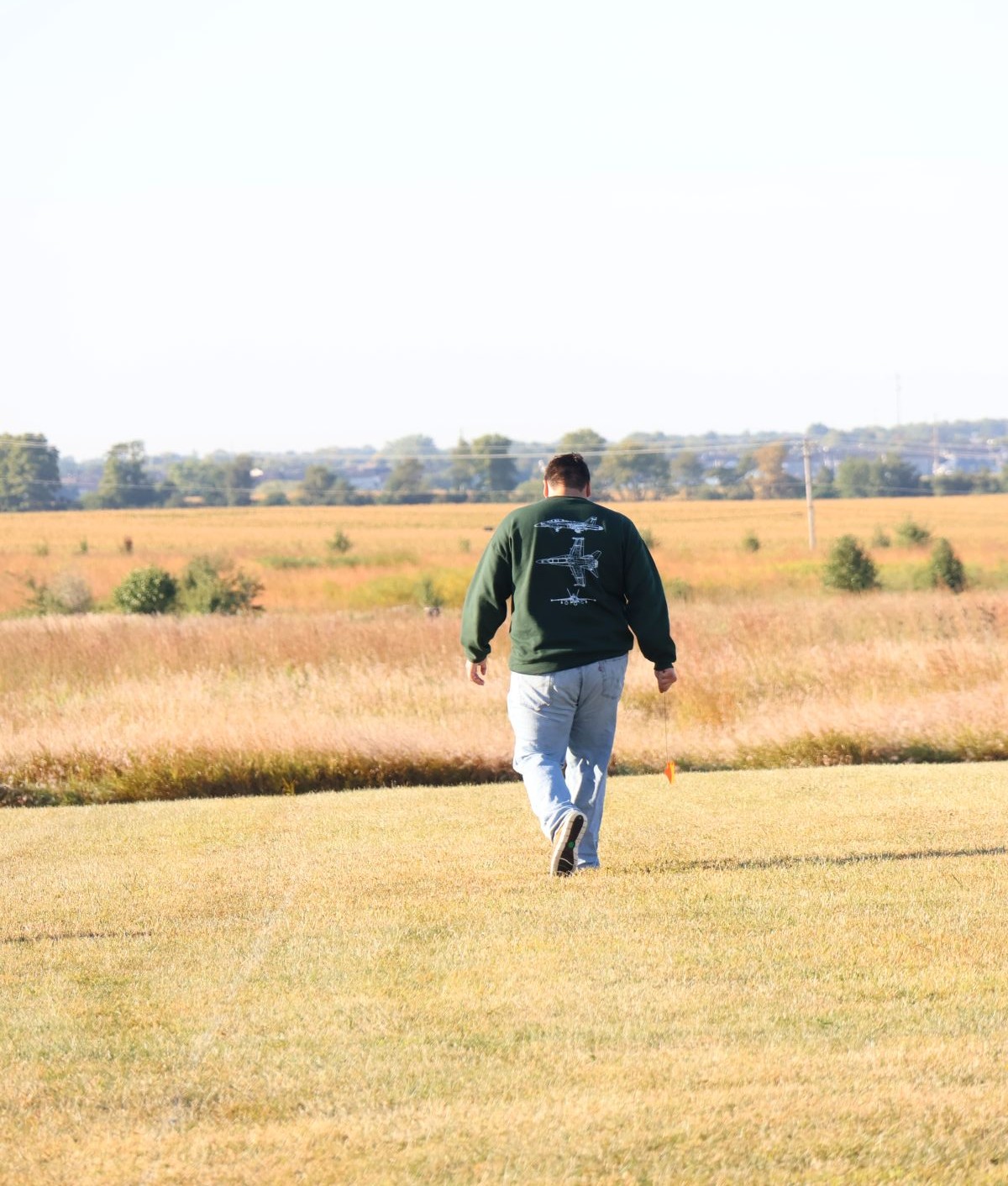 Sanchez walking in a field
