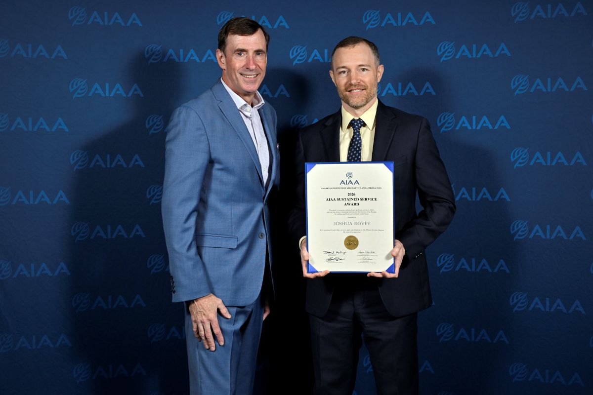 Joshua Rovey holding his 2026 AIAA Sustained Service Award with AIAA CEO Clay Mowry.