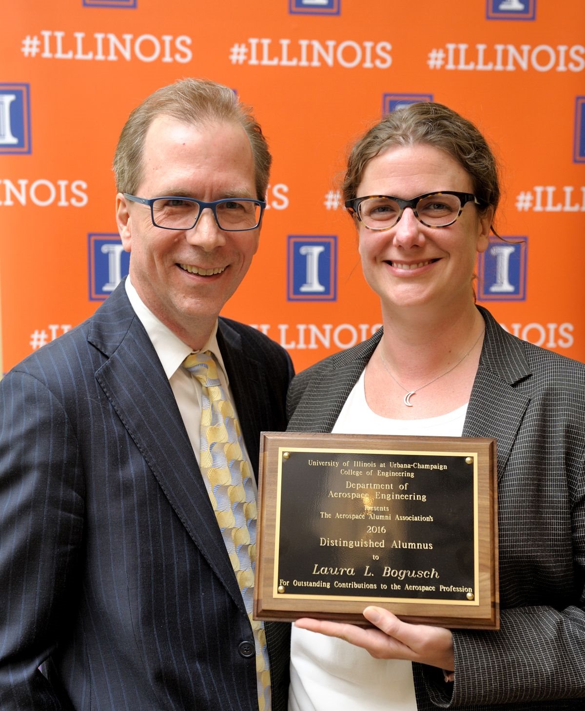 In 2016, Laura Bogusch received the Dept. of Aerospace Engineering's Distinguished Alumni award, seen here with her adviser, Scott White.