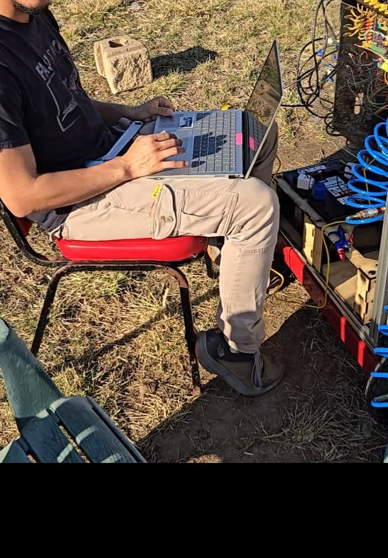 Zapata Zuluaga running a waterflow on Liquid Rocketry at Illinoisâ€™ test stand fluids system to characterize the discharge coefficient.