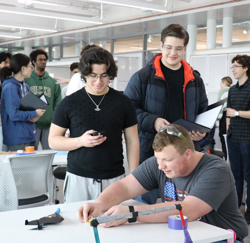 students perparing their glider to launch