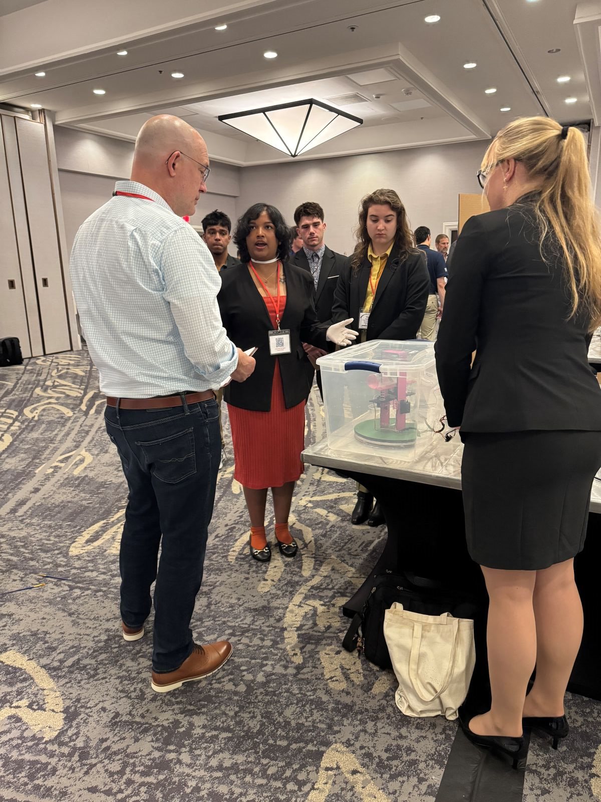 Suhani Verma describing the prototype of the size beneficiator at the competition which tied for the Best Prototype award.