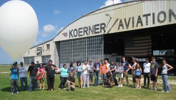 ISGC group at airport hanger