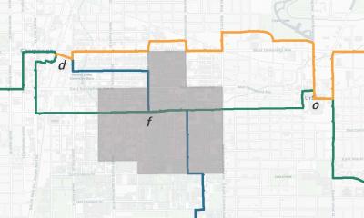 Map shows the three routes considered in the case study: Green, Orange, and Teal. Letter o denotes the origin stop located in downtown Urbana, f is a transfer stop, and d is the destination in downtown Champaign. The highlighted area indicates the parts of city with irregular and high pedestrian traffic.