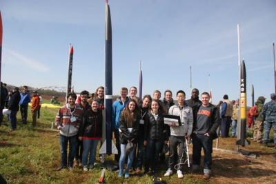 Illinois Space Societyâ€™s Student Launch team with their rocket at the competition in Huntsville, Alabama.