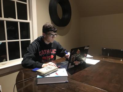 AE senior Ted Lataif works on his senior design project at his home in Georgia. (One of his older sisters gave him a sweatshirt from her Alma Mater.)