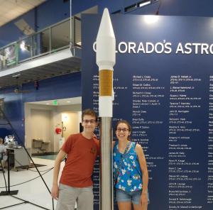 Scott and Noel Brindise with an Atlas V rocket while visiting the Wings over the Rockies Air and Space Museum in Colorado. Both siblings have taken internships with United Launch Alliance, launch service provider for the Atlas.