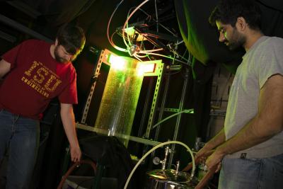 Tim Morgan (left), postdoctoral research associate in the Experimental Multiphase Flow Lab at Iowa State University, pumps water out the catch basin for the coaxial spray test bed while Palash Sashittal, doctoral student in Daniel Bodony's research group at U of I, pumps water into the supply basin that feeds the coaxial spray test bed.   .