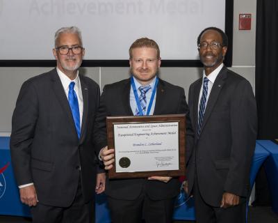 Left to right: Former Langley Research Center Director David Bowles, Brandon Litherland, and the current Langley Research Center Director Clayton Turner.