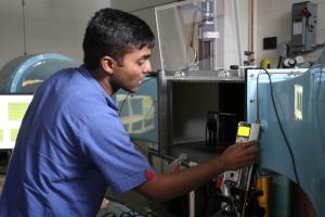 Rohit Gupta setting up a demonstration for IAI students with the wind tunnel.