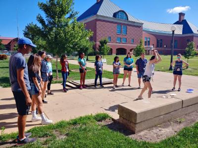 As part of the lesson on structures and materials, the camp participants compared the strength of composite-reinforced ice bricks to regular blocks of ice by breaking them with a hammer.