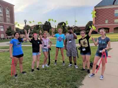An aircraft-control themed game taught the students the importance of teamwork and communications while directing blind-folded classmates around the quad to collect flags.