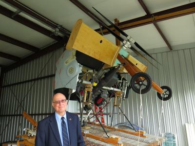 William D. Bertelsen with his arc wing model at James Clements Airport