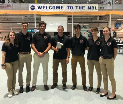 Left to right: Katie Carroll, David Gable, Noah Henricks, Astronaut Mike Hopkins, George Petrov , Zana Essmeyer, and Harriet Hunt