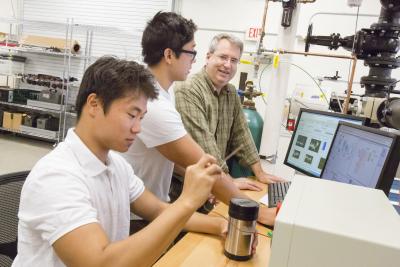 Elliott in the lab with students