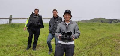Elias Waddington (holding remote control) and co-workers during a search and rescue flight.