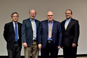 Left to right: Executive Associate Dean Martin Wong, Professor and Head of the Department of Aerospace Engineering Philippe Geubelle, Professor John Lambros, and College of Engineering Dean Rashid Bashir after the investiture in November 2018 at which Lambros was officially named as a Donald Biggar Willett Professor of Engineering.