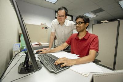 Huck Beng Chew, left, with student Abhilash Harpale