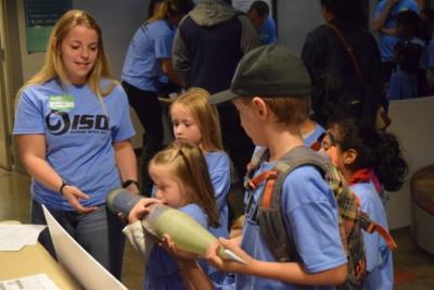 An Iss member demonstrates the use of a nosecone for a high-power rocket.
