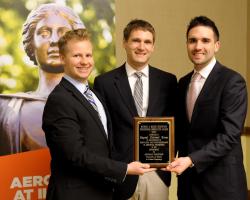 McKale F. Berg, winner of the Michael A. Miller Aerospace Engineering Innovation Award, Assistant Prof. Zach Putnam, and co-winner Richard Kunde. Not pictured are co-winners Dawn Haken, Ethan Verebelyl, Emilio Garcia and Channing Philbrick, Jr.