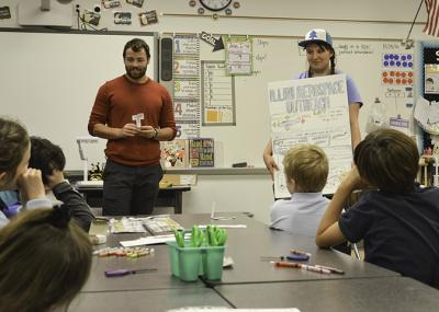 Graduate student Elle Wroblewski, right, helps teach younger students about aerodynamics at the Booker T. Washington STEM Academy Family Engineering Night.