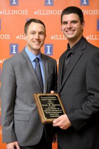 Director of Undergraduate Programs Brian Woodard and Brent Pomeroy, winner of the Faculty Outstanding Graduate Award