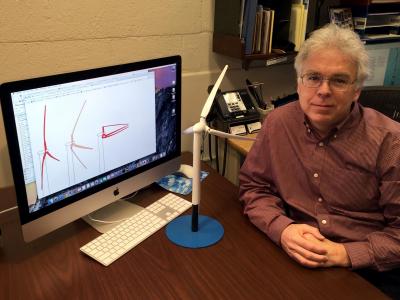 Prof. Michael Selig with a model of the Segmented Ultralight Morphing Rotor design. The illustration displayed on the computer screen is by TrevorJohnston.com/Popular Science.