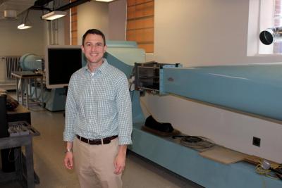 Brian Woodard with two of the wind tunnels in the undegraduate laboratory.