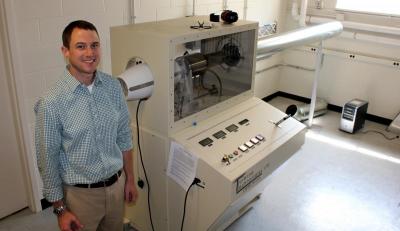 Brian Woodard with the undergrad lab's new turbojet engine.