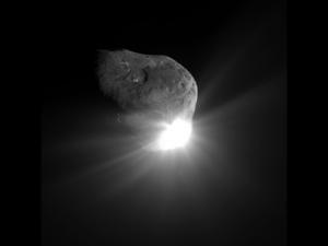 This photo was taken by one of the two Deep Impact spacecraft. The second spacecraft, weighing 820 lb,  collided with the comet Tempel 1 just 67 seconds earlier, on July 4, 2005. The impact of an asteroid deflection spacecraft would look just like this.