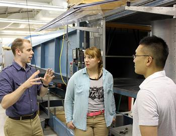 New AE Assistant Prof. Phillip Ansell, left, discusses his work with students Gabrielle Wroblewski and Je Won Hong.