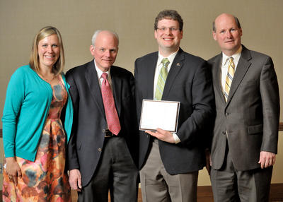 From right, Department Head Philippe Geubelle with Edward A. Whalen; Edward's father, Edward Whalen; and the younger Edward's wife, Kelly Whalen