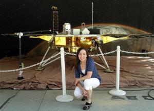 Lynn Craig (BS '00) with the Mars Phoenix Lander Full-Size model at NASA Jet Propulsion Laboratory in Pasadena, CA.