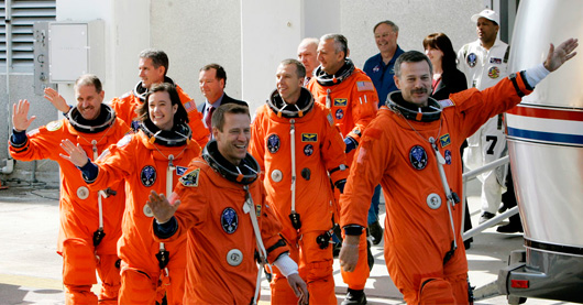 Space shuttle Atlantis crew, from right, commander Scott D. Altman, pilot Gregory C. Johnson, mission specialist, K. Megan McArthur, mission specialist John Grunsfeld and mission specialist Andrew Feustel, mission specialist Michael Good and mission specialist Michael Massimino, leave the Operations and Checkout building enroute to board the shuttle at Kennedy Space Center in Cape Canaveral, Fla., Monday, May 11, 2009. (AP Photo/John Raoux)