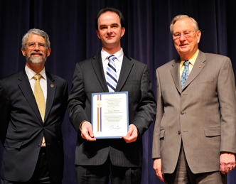 AE Prof. Ioannis Chasiotis, middle, accepts the PECASE Award at the Jan. 13 ceremony at the White House. With him are John Holdren (left), Director of the White House Office of Science and Technology Policy, Assistant to the President for Science and Technology, and Co-Chair of the President's Council of Advisors on Science and Technology, and Arden L. Bement, Jr., National Science Foundation Director.