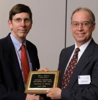 From left, AE Prof. and College of Engineering Associate Dean for Academic Affairs Michael B. Bragg presents Research Laboratory Shop Supervisor Kent Elam with the AE Staff of the Year Award.