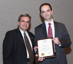 At right, Ares Rosakis, Chair of the ASME Applied Mechanics Division and Dean of Engineering of the California Institute of Techology, presents AE Prof. Ioannis Chasiotis with the J.R. Hughes Young Investigator Award.