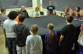 Illinois Space Day visitors watch a demonstration of the Orbital Simulator exhibit.