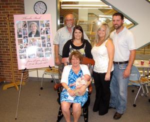 Barb Kirts with her family during her retirement party.