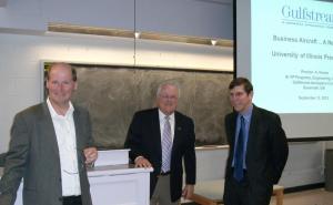 With Henne are Philippe Geubelle, AE Department Head, left, and Mike Bragg, College of Engineering Interim Dean, right.