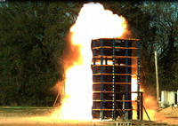 Figure 4: The nine-story structure undergoing a 90 psi-ms blast test at the Army Corps of Engineers Big Black test site near Vicksburg, MI.